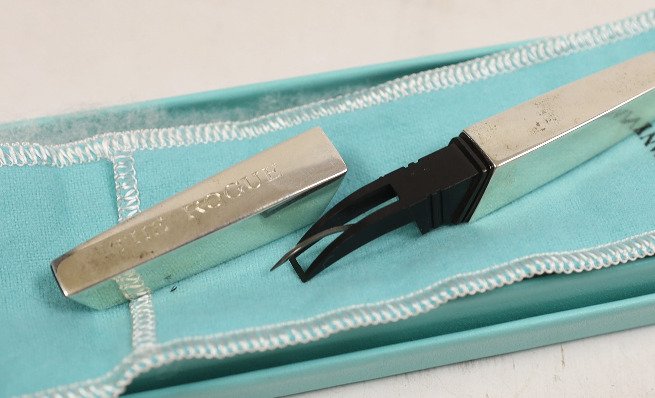 A modern Mexican 925 Tiffany & Co paper cutter, engraved 'The Rogue', 10.5cm, with Tiffany & Co pouch and box.